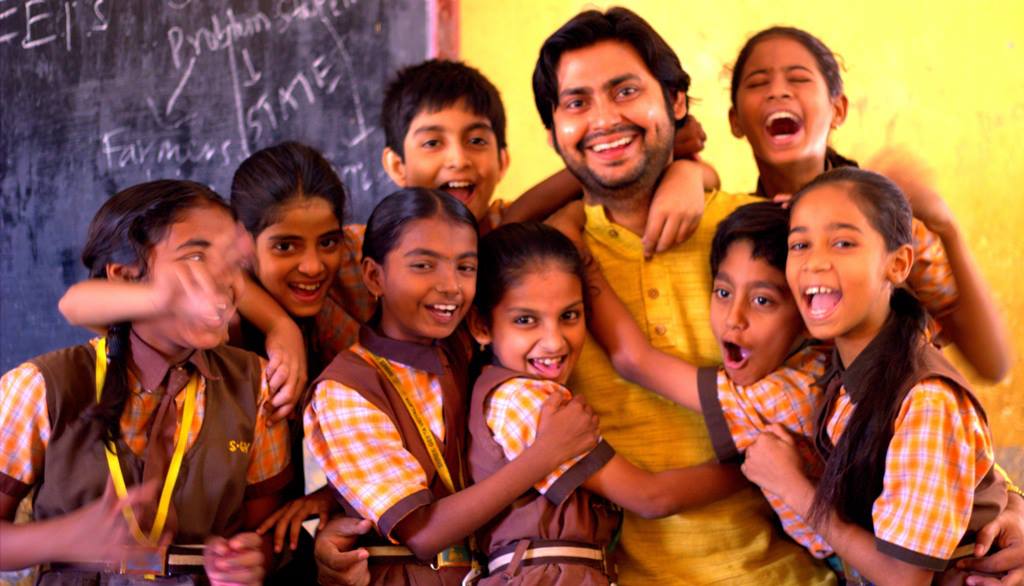 Vijay, founder of VVK Education Foundation, with students at a school in Maharashtra