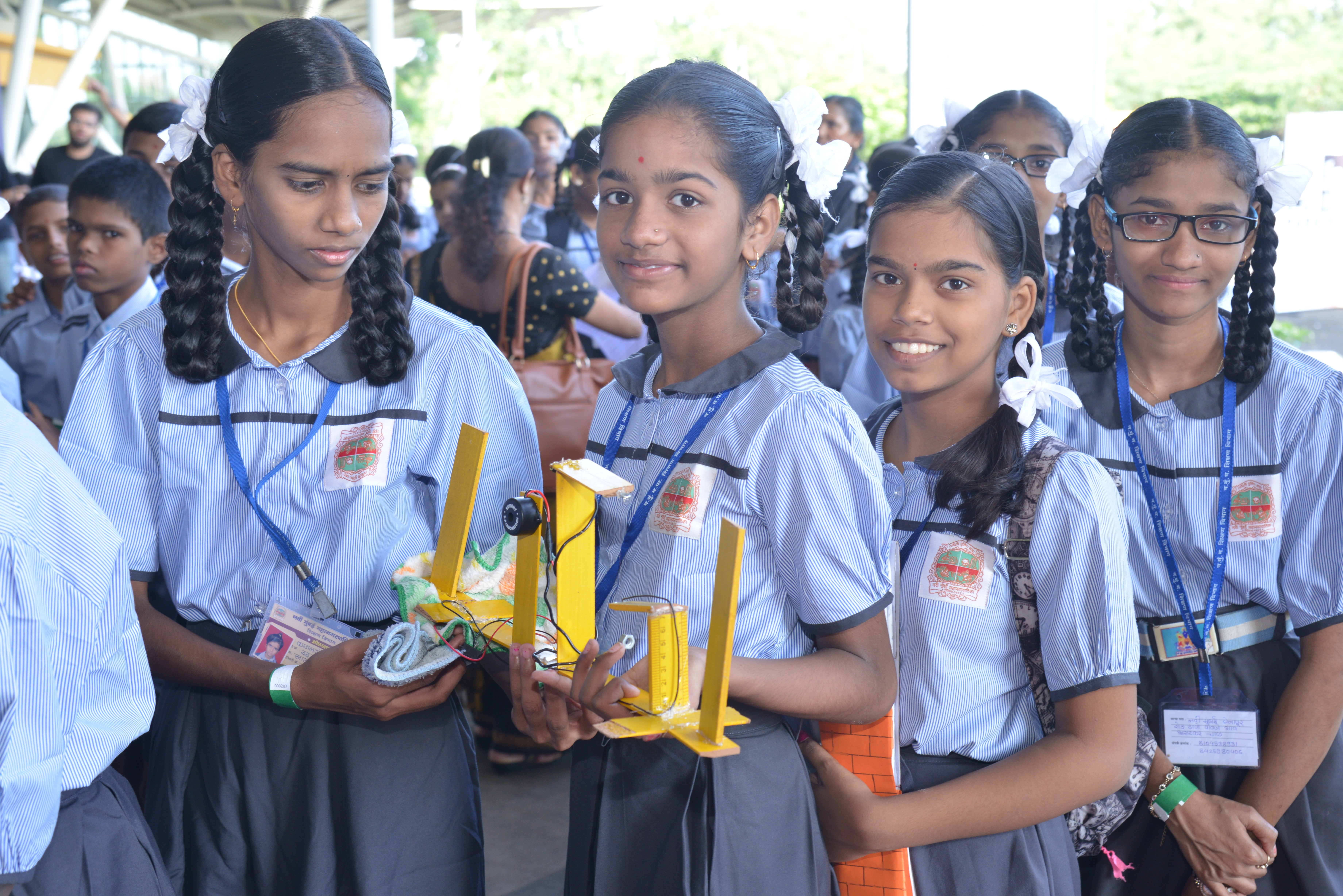 Students holding a science project during a VVK Education Foundation student enrichment program in Maharashtra